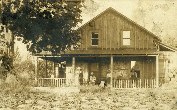 Japanese Canadian family on the porch of their family home circa 1925